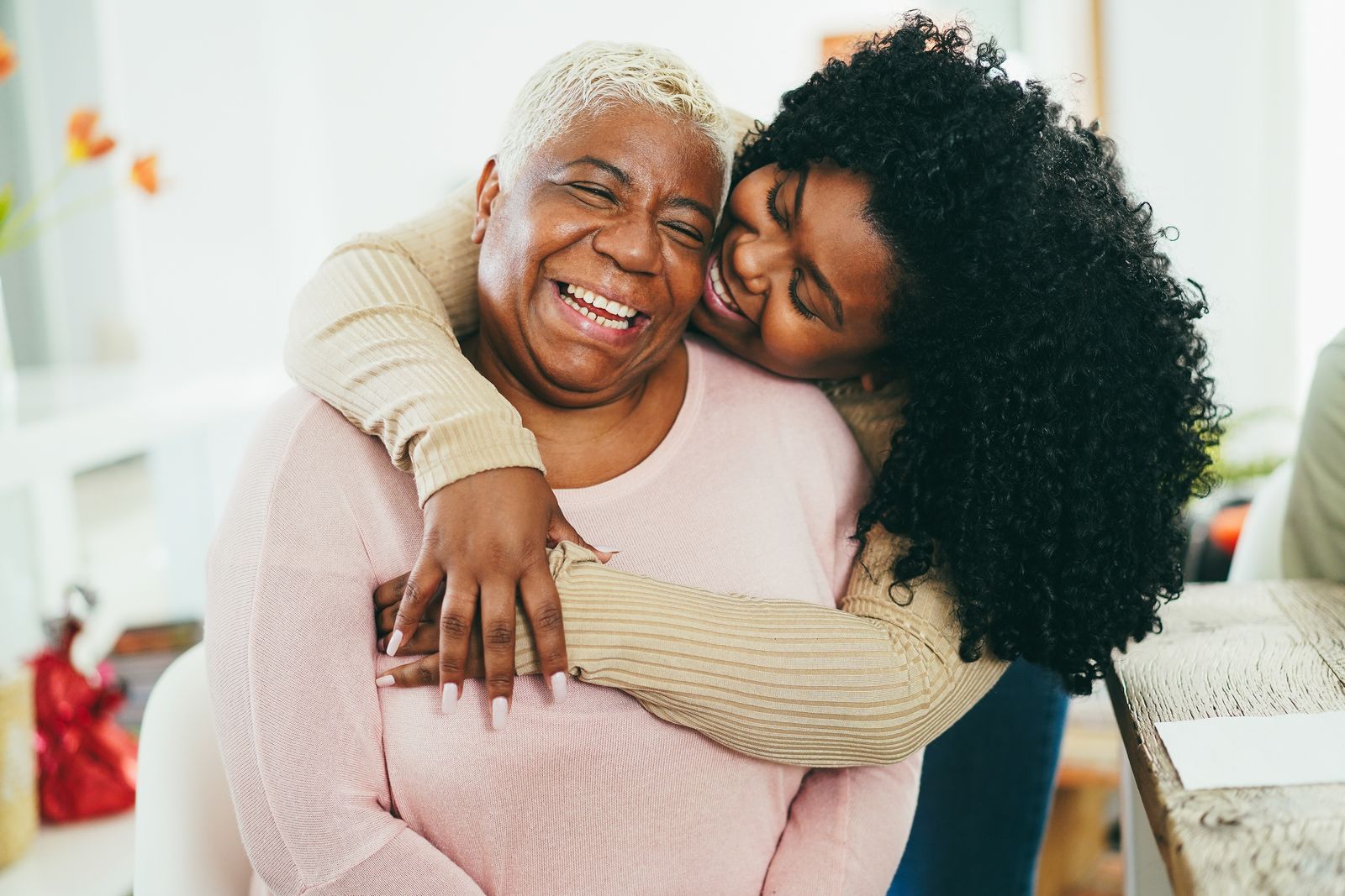 two women hugging and smiling