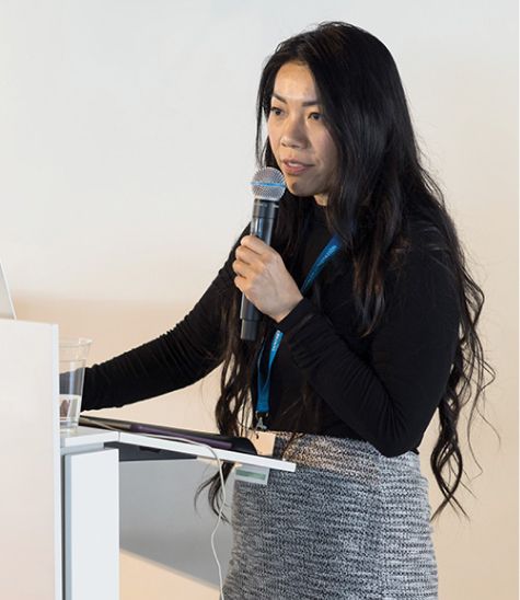 woman talking into microphone